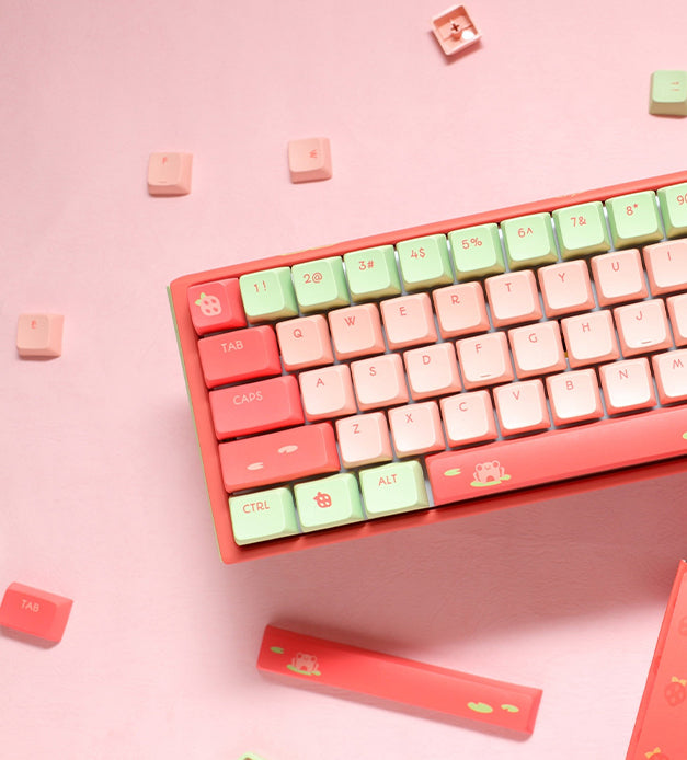 Ducky Strawberry frog mechanical keyboard on pink background with matching pink and green keycaps